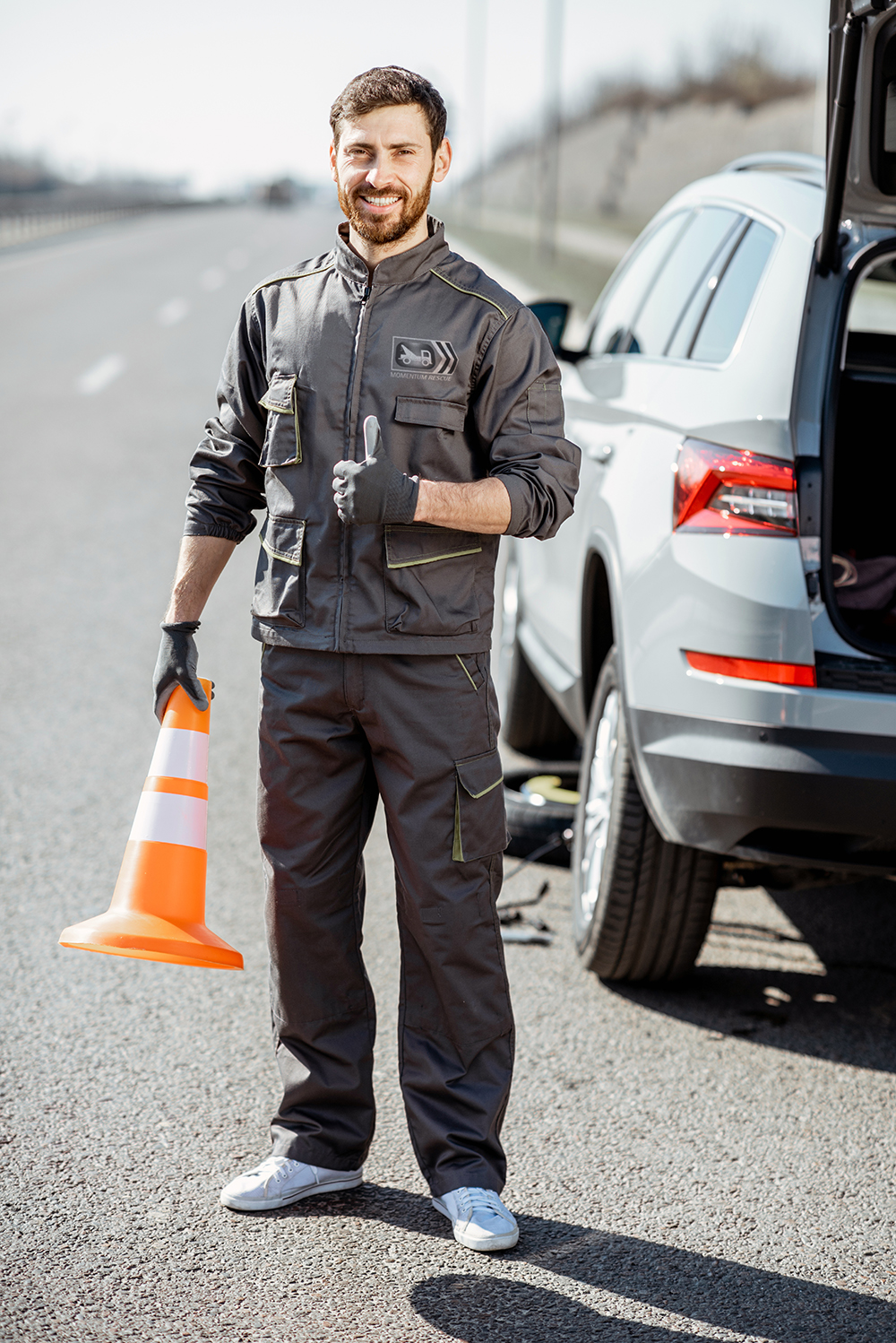 road assistance worker on the roadside momentum